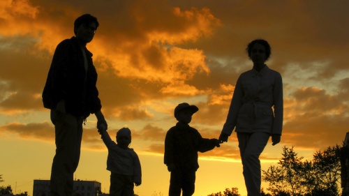 A silhouette of a family of four.