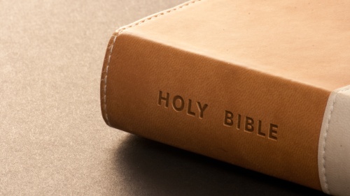 A leather Bible on a table.