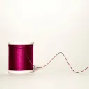 Um carretel de linha se desenrolando