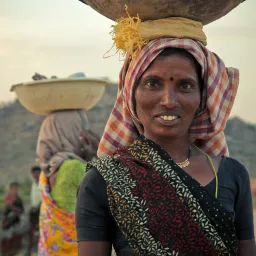 woman holding basket on her head
