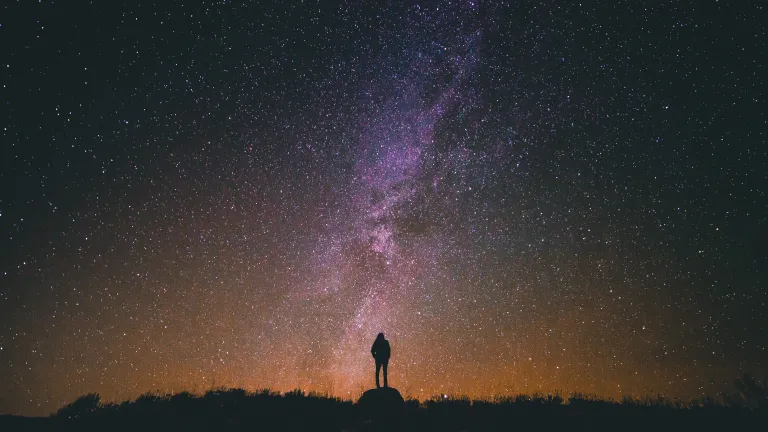 man looking at the Milky Way