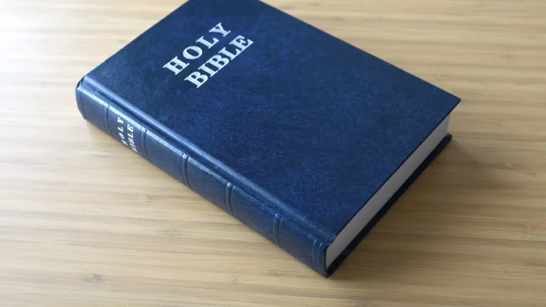 A Bible laying on a table.