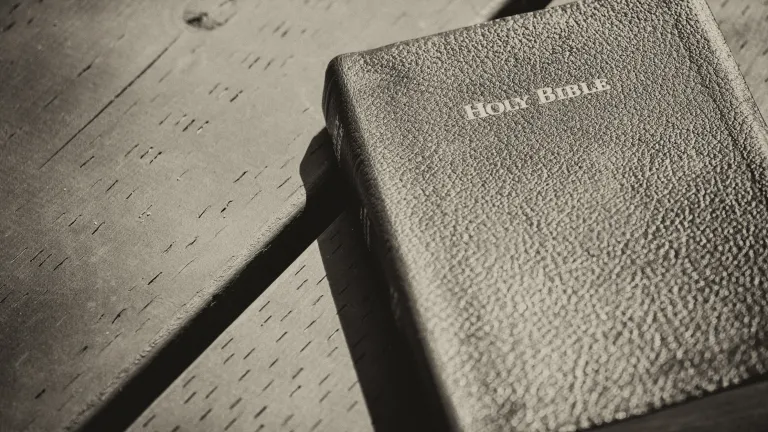 Bible laying on top of a table