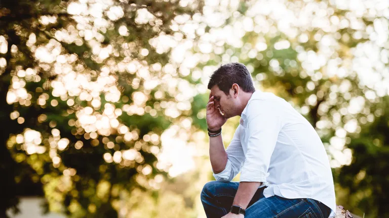 Like King David, we should cry out to God to "create in me a pure heart" A man sitting and praying.