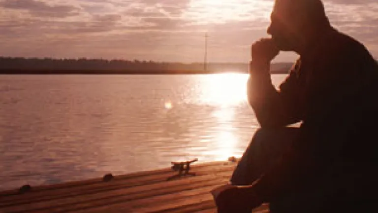 Man sitting on a pier