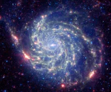 A photo of a cluster of stars in the sky.