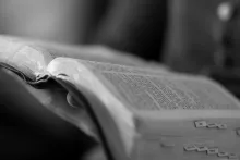 A person holding a Bible.