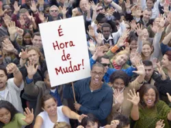 Man holding a sign in a crowd